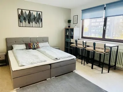 Ein Bett oder Betten in einem Zimmer der Unterkunft LENASTAY I Modernes Apartment-Studio near Uni