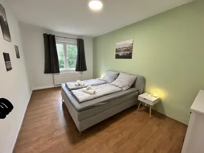 Ein Bett oder Betten in einem Zimmer der Unterkunft Zentrale 3Zimmer Wohnung mit Stellplatz
