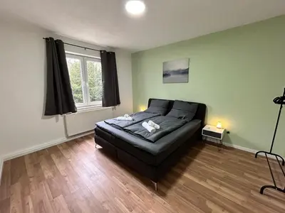 Ein Bett oder Betten in einem Zimmer der Unterkunft Zentrale 3Zimmer Wohnung mit Stellplatz