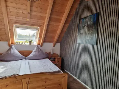 Ein Bett oder Betten in einem Zimmer der Unterkunft PalatinaZeit - WEINblick - Ferienwohnung im Haus Petry - Freinsheim - Pfalz