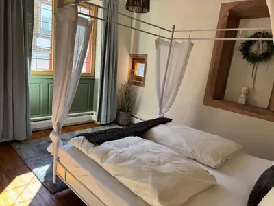 Ein Bett oder Betten in einem Zimmer der Unterkunft Schmuckstück-Maikammer