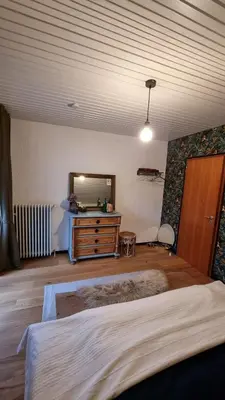 Ein Bett oder Betten in einem Zimmer der Unterkunft Ferienwohnung Am Kirchberg