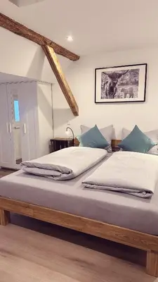 Ein Bett oder Betten in einem Zimmer der Unterkunft Heimatliebe Wohnung FÜNF