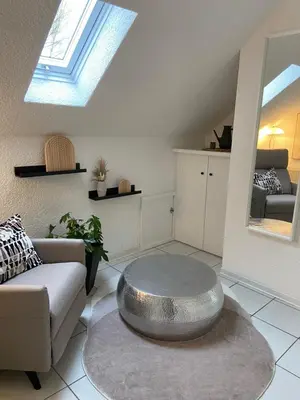 Ein Sitzbereich in der Unterkunft Ferienwohnung am Erbacher Mümlingufer
