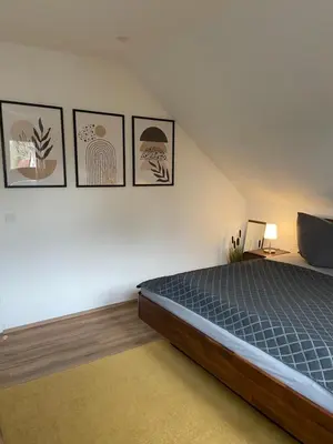 Ein Bett oder Betten in einem Zimmer der Unterkunft Ferienwohnung am Erbacher Mümlingufer