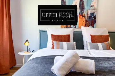 Ein Bett oder Betten in einem Zimmer der Unterkunft UPPER ROOM Apartment im Zentrum