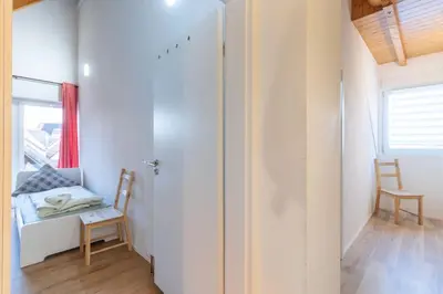 Ein Bett oder Betten in einem Zimmer der Unterkunft Maisonette-Wohnung mit 5 Schlafzimmern