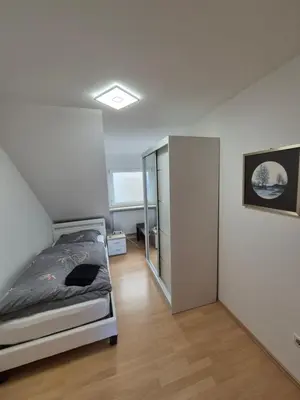 Ein Bett oder Betten in einem Zimmer der Unterkunft FeWo Neckarsteinach