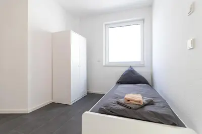 Ein Bett oder Betten in einem Zimmer der Unterkunft 105qm Wohnung für max. 7 Personen