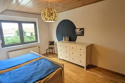 Ein Bett oder Betten in einem Zimmer der Unterkunft Ferienoase mit Dachterrasse nahe Sankt Leoner See