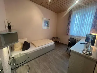 Ein Bett oder Betten in einem Zimmer der Unterkunft Hotel Cronberger Hof