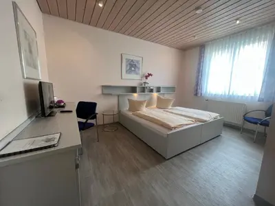 Ein Bett oder Betten in einem Zimmer der Unterkunft Hotel Cronberger Hof