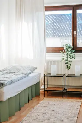 Ein Bett oder Betten in einem Zimmer der Unterkunft namastay! City-Apartment in Bestlage