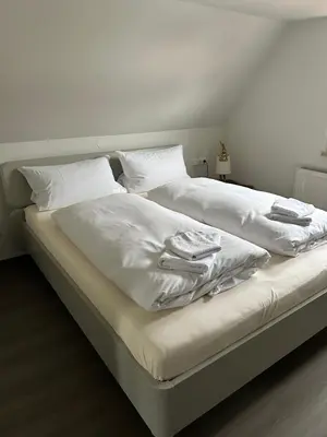 Ein Bett oder Betten in einem Zimmer der Unterkunft Krönchen