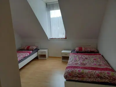 Ein Bett oder Betten in einem Zimmer der Unterkunft Ferienwohnung Enz, 3 OG.