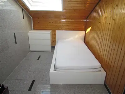 Ein Bett oder Betten in einem Zimmer der Unterkunft Ferienwohnung am Heuchelberg