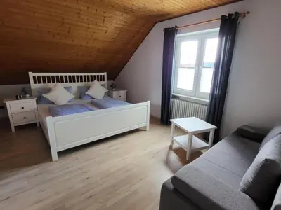 Ein Bett oder Betten in einem Zimmer der Unterkunft Pension Sonnenberg Comfortable holiday residence
