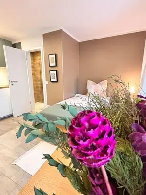 Ein Bett oder Betten in einem Zimmer der Unterkunft Nahe Frankfurt Flughafen & Messe