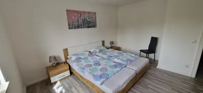 Ein Bett oder Betten in einem Zimmer der Unterkunft Ferienwohnung am Panoramaweg