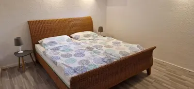 Ein Bett oder Betten in einem Zimmer der Unterkunft Ferienwohnung am Panoramaweg