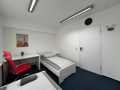 Ein Bett oder Betten in einem Zimmer der Unterkunft Mieterlux Frankfurt Heusenstamm 46