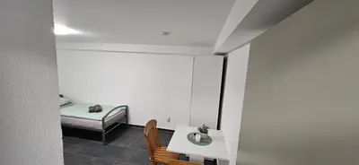 Ein Bett oder Betten in einem Zimmer der Unterkunft Unterkunft Mainz Laubenheim