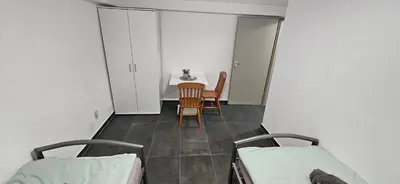 Ein Sitzbereich in der Unterkunft Unterkunft Mainz Laubenheim