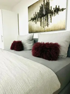 Ein Bett oder Betten in einem Zimmer der Unterkunft Vinum Apartment