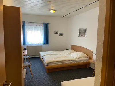 Ein Bett oder Betten in einem Zimmer der Unterkunft Hotel Sonne