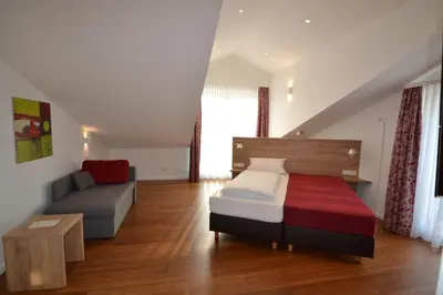 Ein Bett oder Betten in einem Zimmer der Unterkunft Weinhaus Steppe Hotel 3***Superior und Weinstube