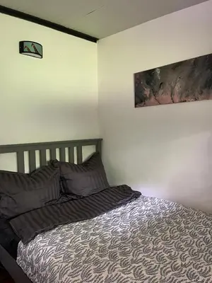 Ein Bett oder Betten in einem Zimmer der Unterkunft Datscha am See
