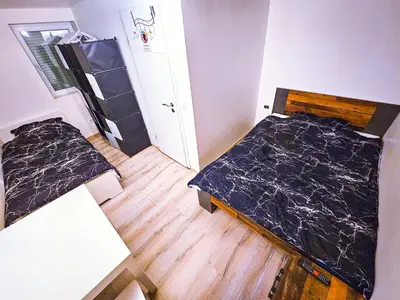Ein Bett oder Betten in einem Zimmer der Unterkunft Shared house Gebersheim Leonberg