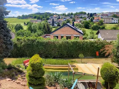 Ein Garten an der Unterkunft Apartment Joelle mit Sauna, Schwimmteich und Gym