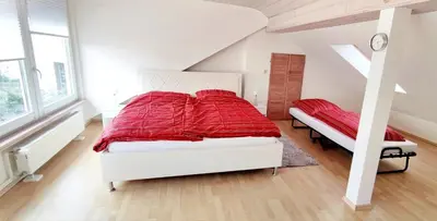 Ein Bett oder Betten in einem Zimmer der Unterkunft Gemütliches Gästehaus am Park