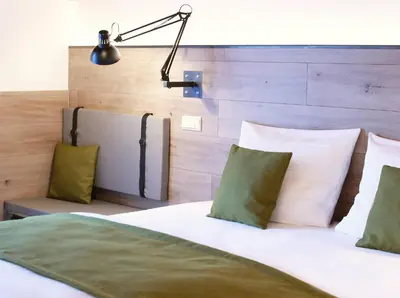 Ein Bett oder Betten in einem Zimmer der Unterkunft Weingut-Gästehaus Buchert