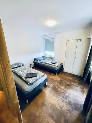 Ein Bett oder Betten in einem Zimmer der Unterkunft nJoy! Comfort Apartment Bietigheim - Balkon & gratis WLAN