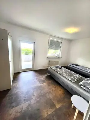 Ein Bett oder Betten in einem Zimmer der Unterkunft nJoy! Comfort Apartment Bietigheim - Balkon & gratis WLAN