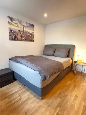 Ein Bett oder Betten in einem Zimmer der Unterkunft Kleines Juwel mit super Komfort - Fußbodenheizung, Regendusche, Waschmaschine
