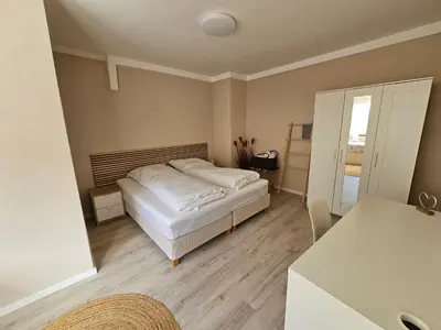 Ein Bett oder Betten in einem Zimmer der Unterkunft Rheinhessenglück