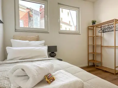 Ein Bett oder Betten in einem Zimmer der Unterkunft Apartment im Herzen der Altstadt - Leonberg nähe Stuttgart