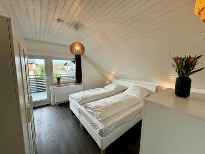 Ein Bett oder Betten in einem Zimmer der Unterkunft Odenwaldpanorama