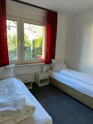 Ein Bett oder Betten in einem Zimmer der Unterkunft 7 Zimmer Haus in Kaiserslautern
