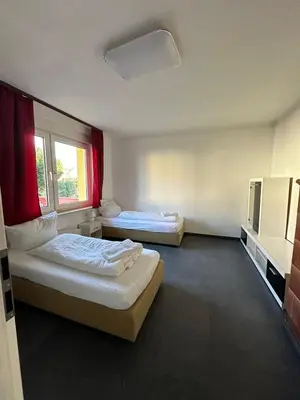 Ein Bett oder Betten in einem Zimmer der Unterkunft 7 Zimmer Haus in Kaiserslautern
