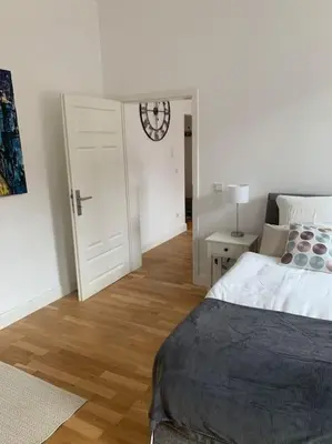 Ein Bett oder Betten in einem Zimmer der Unterkunft Charmante Altbauwohnung