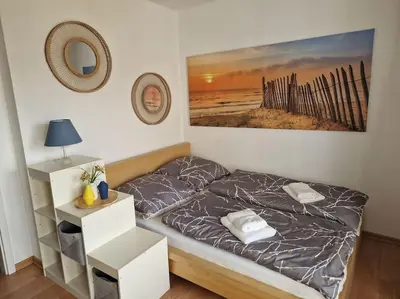 Ein Bett oder Betten in einem Zimmer der Unterkunft Helle, komfortabel und zentral gelegene Wohnung