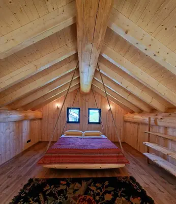 Ein Bett oder Betten in einem Zimmer der Unterkunft Eveningwood - DTV 5 Sterne Luxus Hüttenparadies, Blockhaus