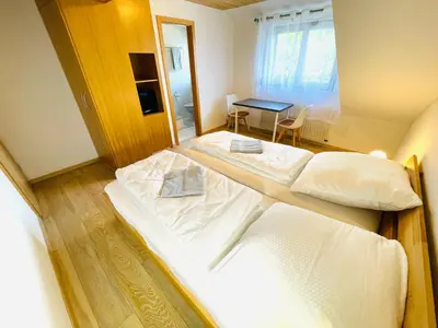 Ein Bett oder Betten in einem Zimmer der Unterkunft Pension Spatzennest