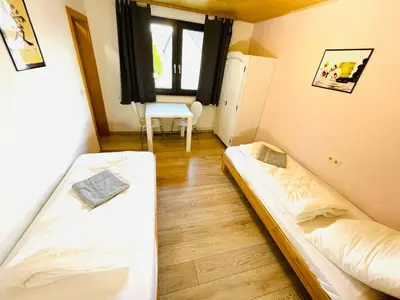 Ein Bett oder Betten in einem Zimmer der Unterkunft Pension Spatzennest