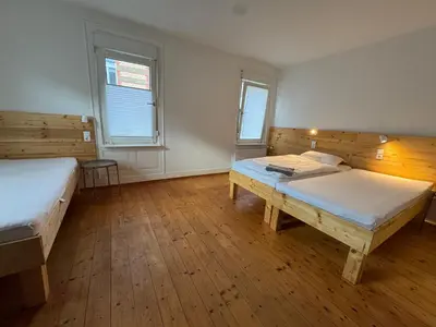 Ein Bett oder Betten in einem Zimmer der Unterkunft 90qm 4-Zimmer-Wohnung - Apartment Friedrichstraße