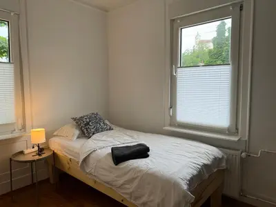 Ein Bett oder Betten in einem Zimmer der Unterkunft 90qm 4-Zimmer-Wohnung - Apartment Friedrichstraße